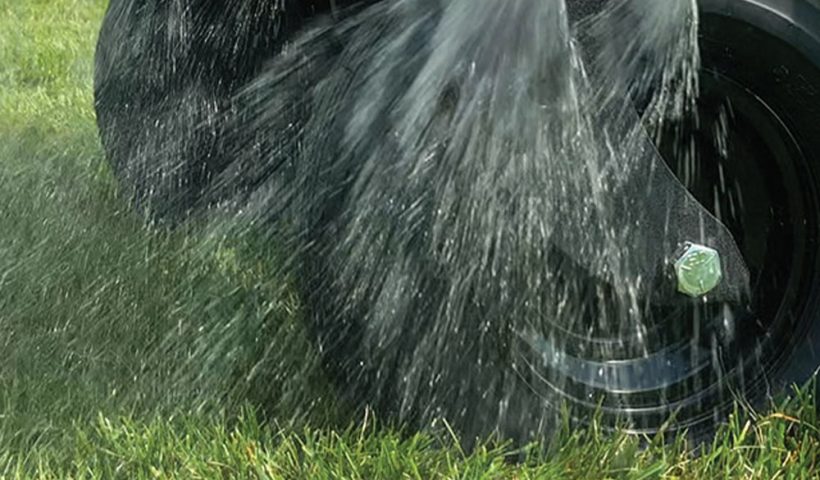 close-up of lawn getting sprayed by water