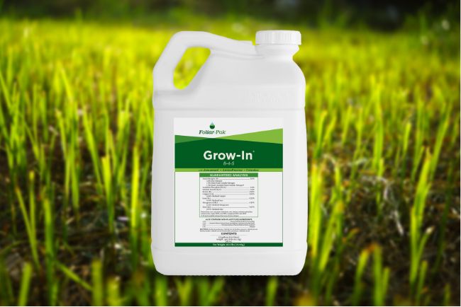 A container of Foliar-Pak® Grow-In on a grassy background